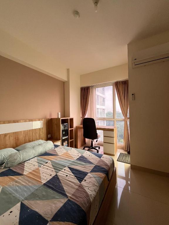 Ένα ή περισσότερα κρεβάτια σε δωμάτιο στο Studio Room at Taman Melati