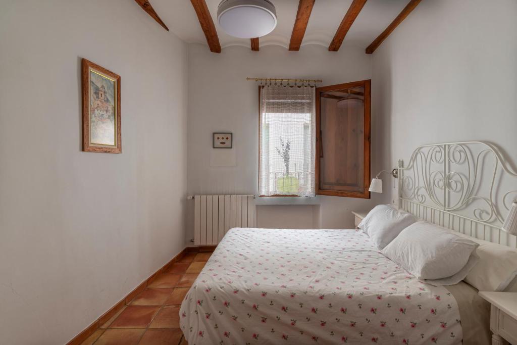 Postel nebo postele na pokoji v ubytování La Llar D'aitana