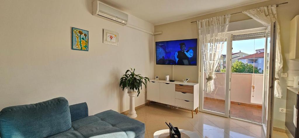 TV a/nebo společenská místnost v ubytování BELLA NINA APARTMENT