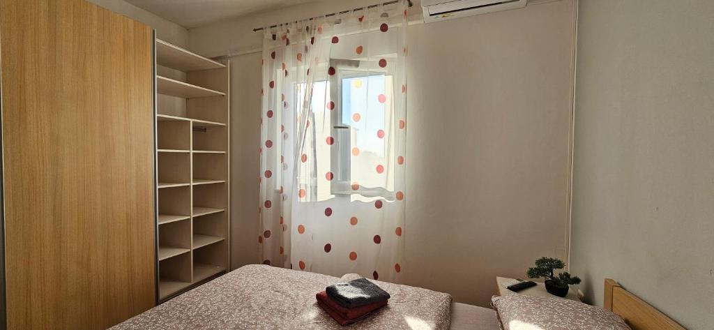 Postel nebo postele na pokoji v ubytování BELLA NINA APARTMENT