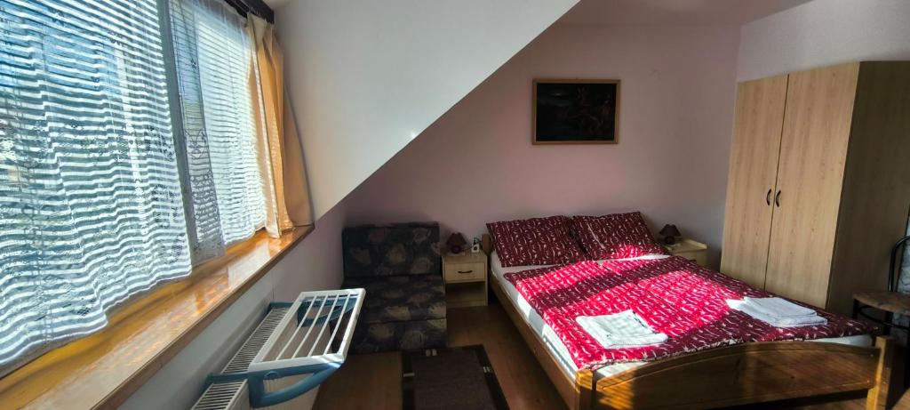 Postel nebo postele na pokoji v ubytování Joós Apartman