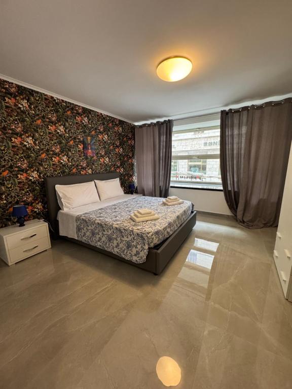 Ένα ή περισσότερα κρεβάτια σε δωμάτιο στο La bella napoli house casa vacanze con 3 camere da letto