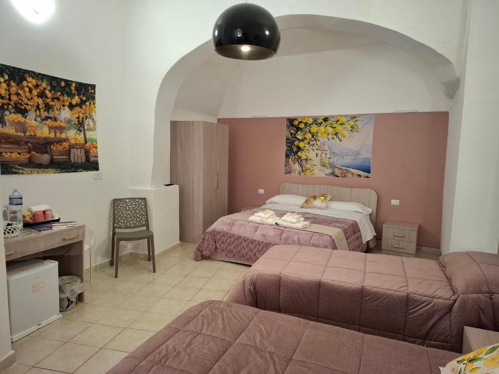 Postel nebo postele na pokoji v ubytování B&B Le Lumìe "Il Cortiletto Del Centro"