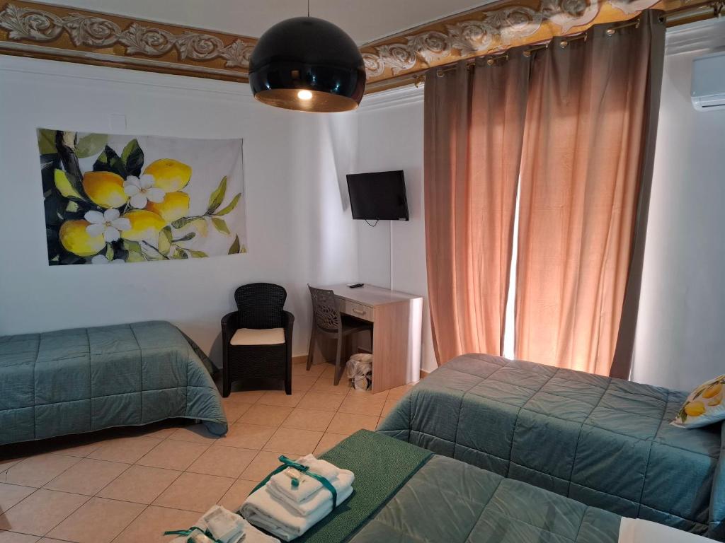 Postel nebo postele na pokoji v ubytování B&B Le Lumìe "Il Cortiletto Del Centro"