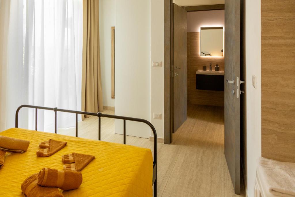 Postel nebo postele na pokoji v ubytování Maris Suite - Appartamento con vasca idromassaggio