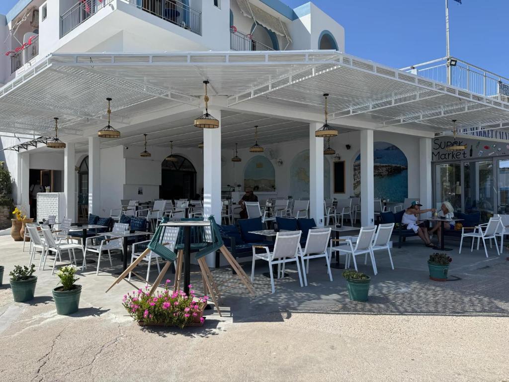 A restaurant or other place to eat at Calypso Hotel