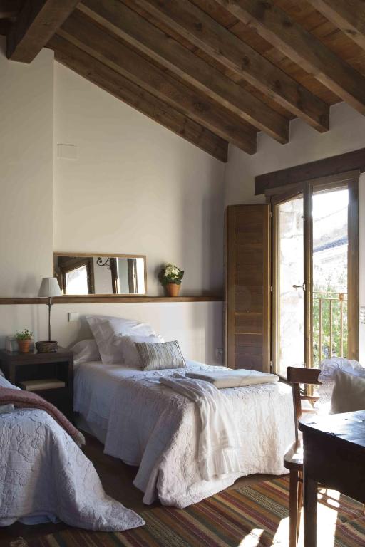 Posteľ alebo postele v izbe v ubytovaní El Hogar del Fresno casa con encanto en Cañicosa