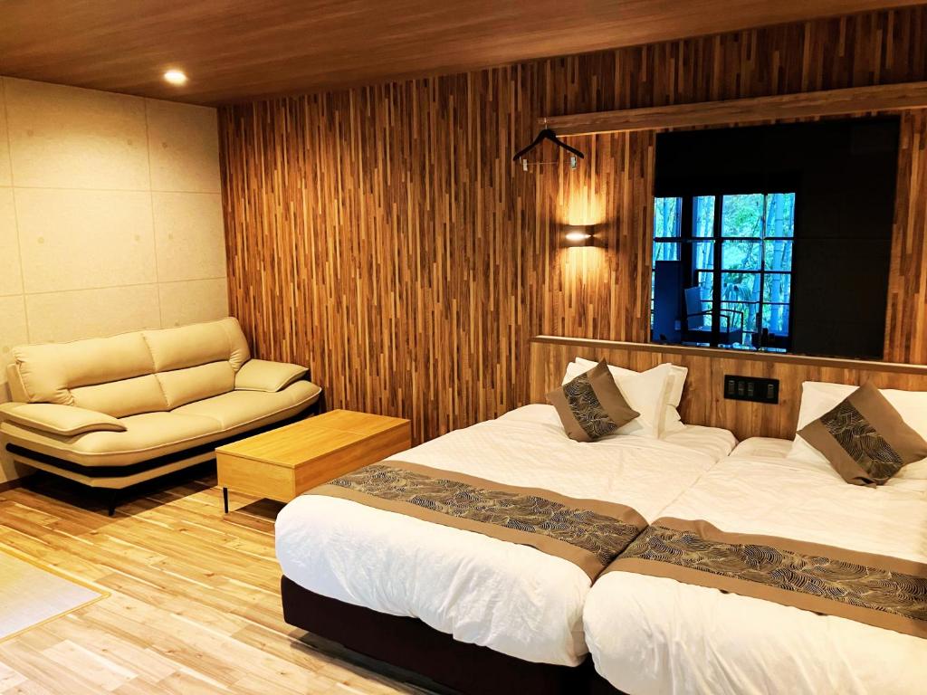 Postel nebo postele na pokoji v ubytování Livemax Resort Sanuki Shionoe Onsen