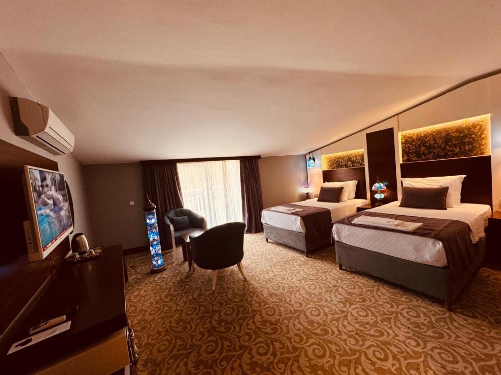 Postel nebo postele na pokoji v ubytování Pamukkale Whiteheaven Suite Hotel