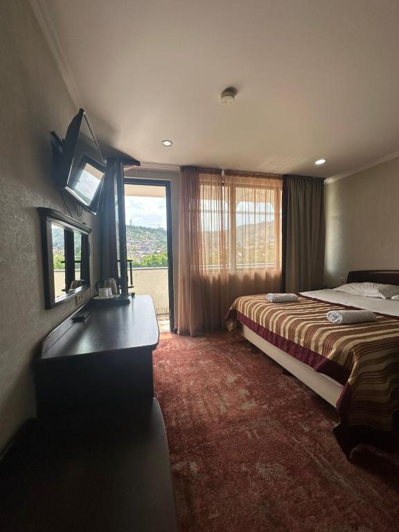 Postel nebo postele na pokoji v ubytování Hotel Beka Palace