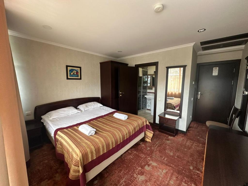 Postel nebo postele na pokoji v ubytování Hotel Beka Palace