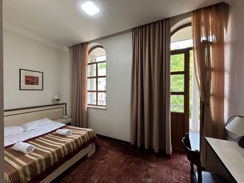 Postel nebo postele na pokoji v ubytování Hotel Beka Palace