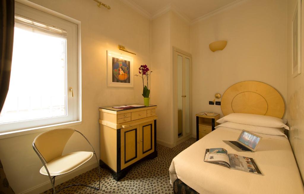 Postel nebo postele na pokoji v ubytování Hotel Gregoriana