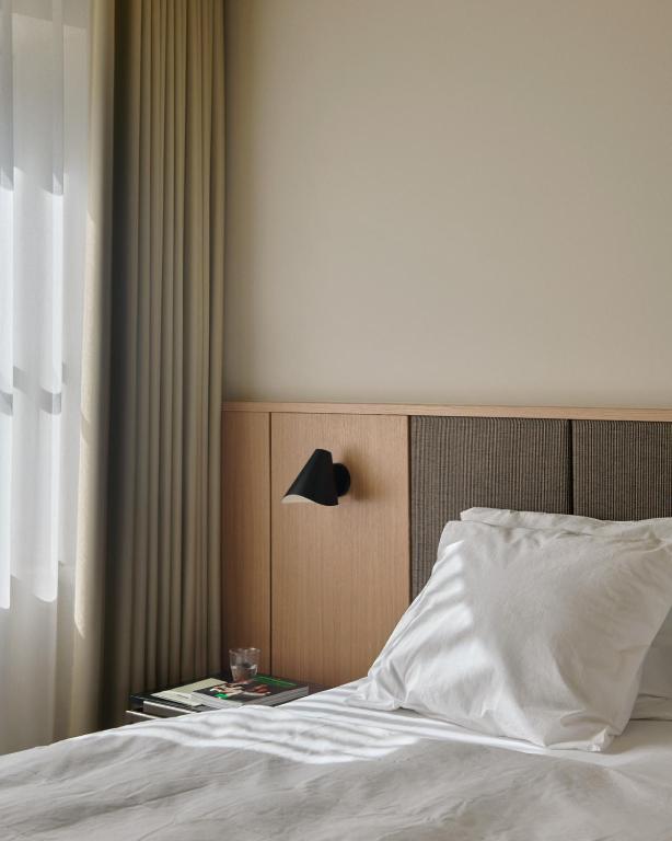 Postel nebo postele na pokoji v ubytování Hotel Petra