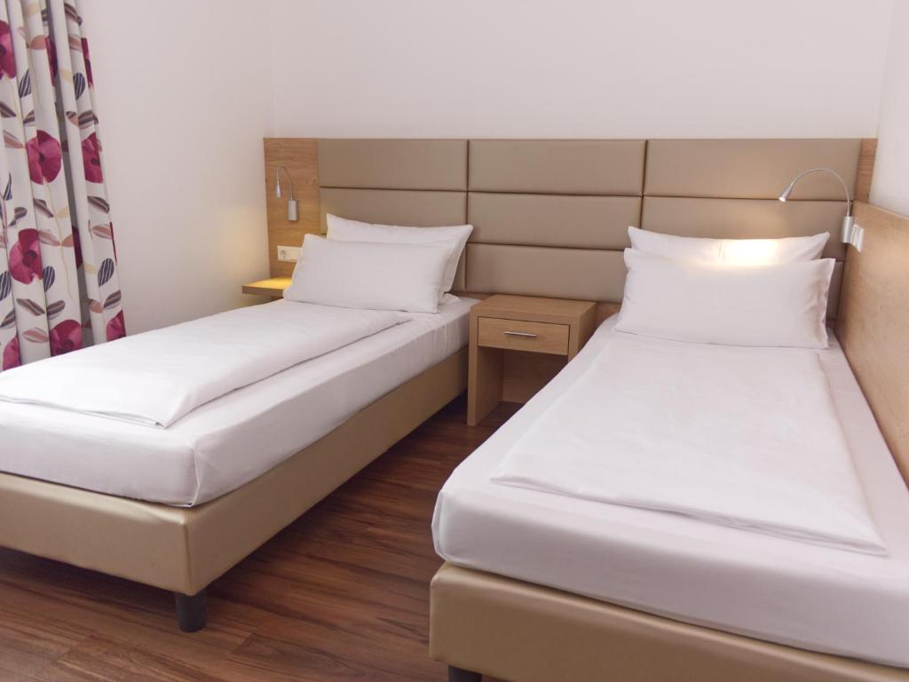 Postel nebo postele na pokoji v ubytování Hotel Wübbel