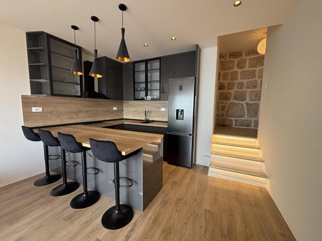 Kuchyň nebo kuchyňský kout v ubytování Indy's Beach Apartments