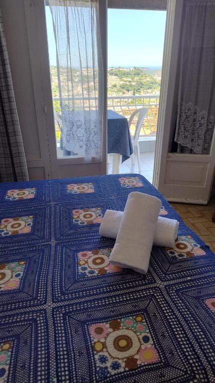a bed with two pillows on top of it at Casa Lucia in Casamicciola Terme