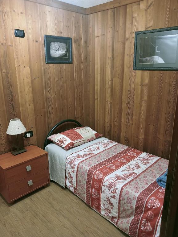 Postel nebo postele na pokoji v ubytování Appartamento Biolley