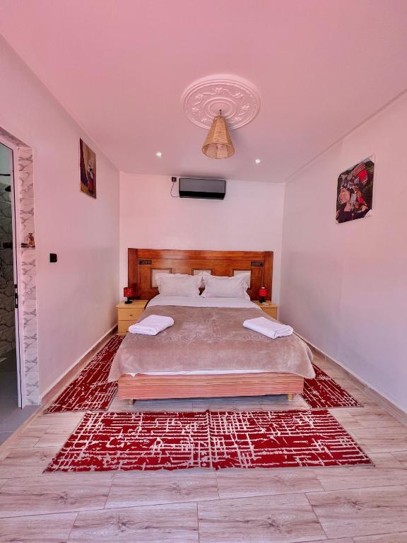 Postel nebo postele na pokoji v ubytování Hotel L'Arganier d'Ammelne