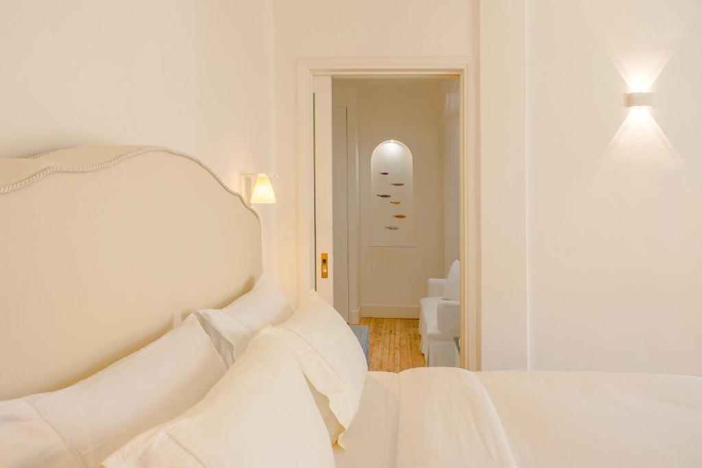 Posteľ alebo postele v izbe v ubytovaní Etoile Luxury Suites