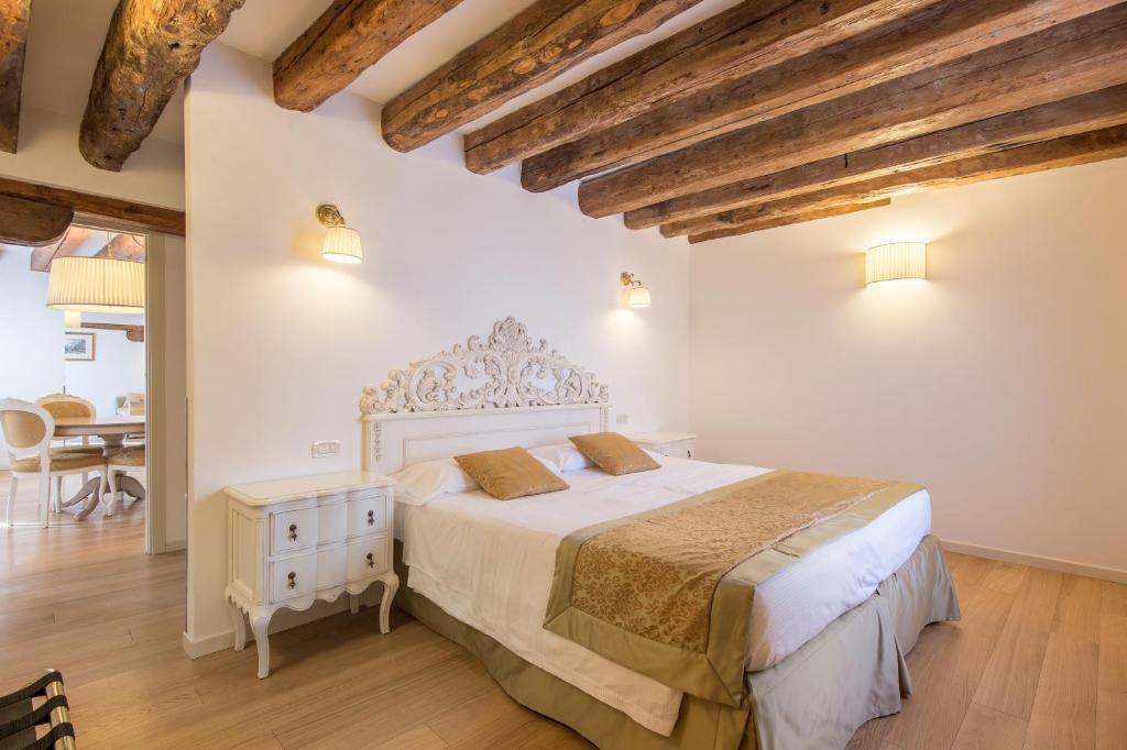 Łóżko lub łóżka w pokoju w obiekcie Al Redentore Di Venezia