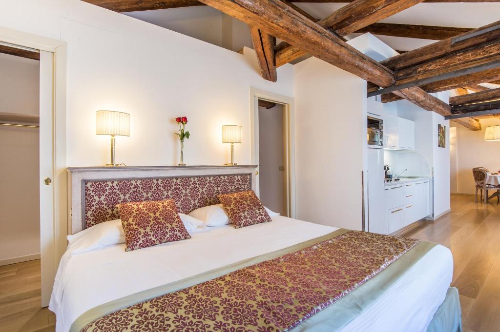 Łóżko lub łóżka w pokoju w obiekcie Al Redentore Di Venezia