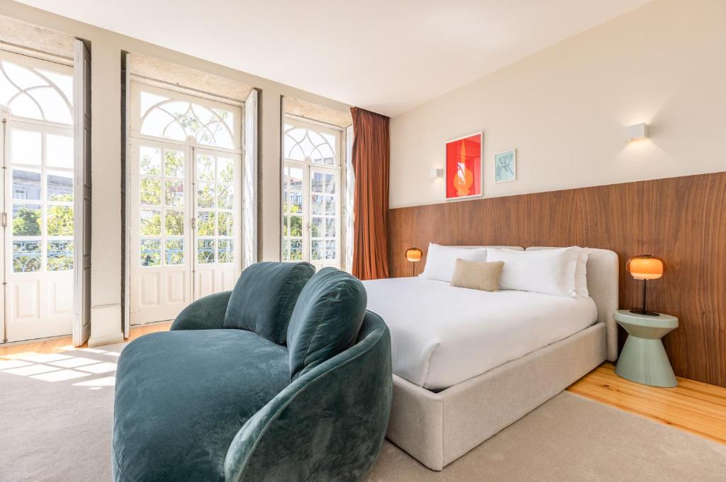 Postel nebo postele na pokoji v ubytování Albertina Carlos Alberto by Aspasios