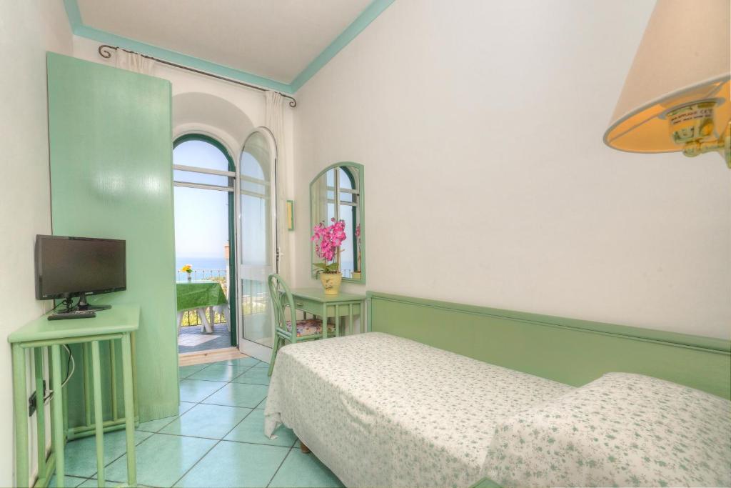 TV a/nebo společenská místnost v ubytování Hotel Casa del Sole