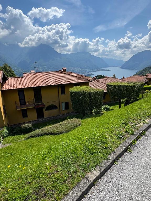 a house on a hill with a green yard at Bellagio, Grigna & Lake Suite in Civenna
