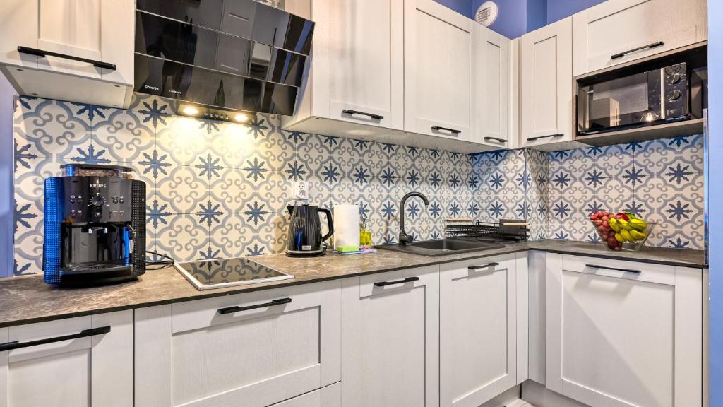 Kuchyňa alebo kuchynka v ubytovaní Apartament Szmaragdowy w Karpatia - 5D Apartamenty