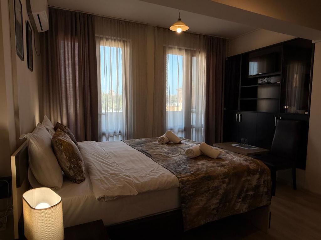 Postel nebo postele na pokoji v ubytování Liva Hotel