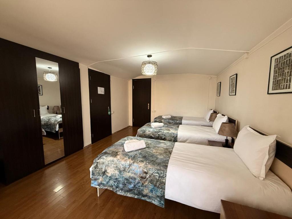 Postel nebo postele na pokoji v ubytování Liva Hotel