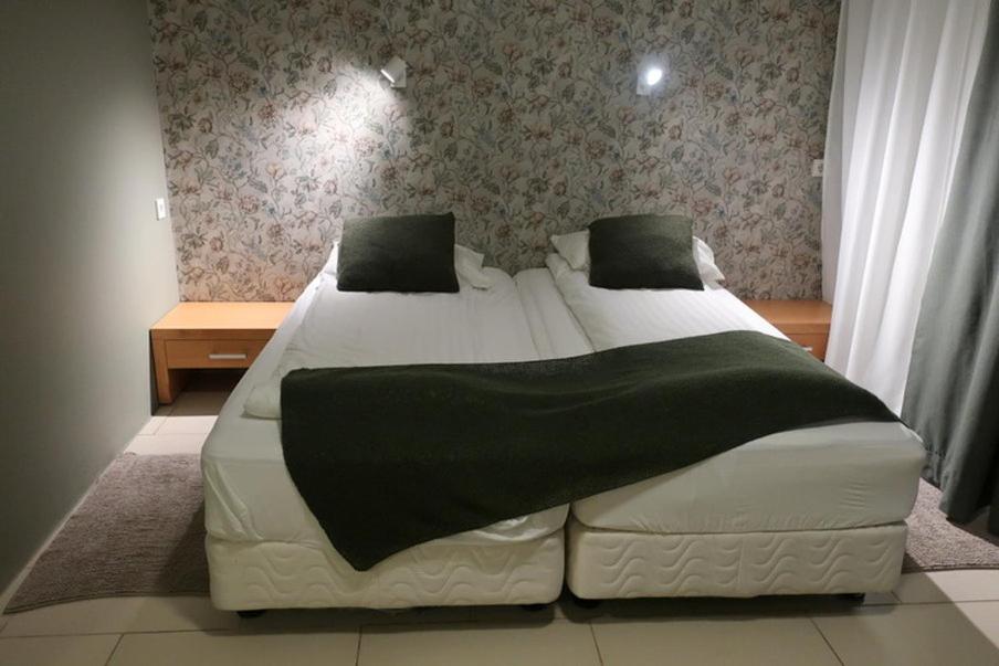 Postel nebo postele na pokoji v ubytování Hotel Laki