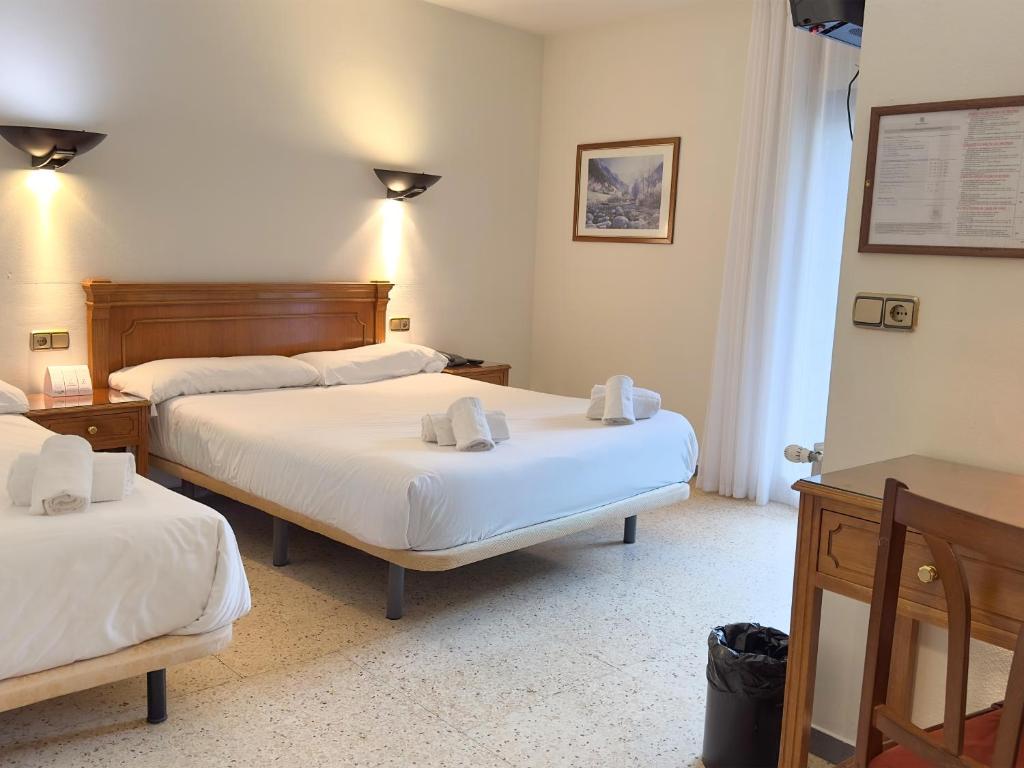 Postel nebo postele na pokoji v ubytování Hotel Pere D'Urg 3000
