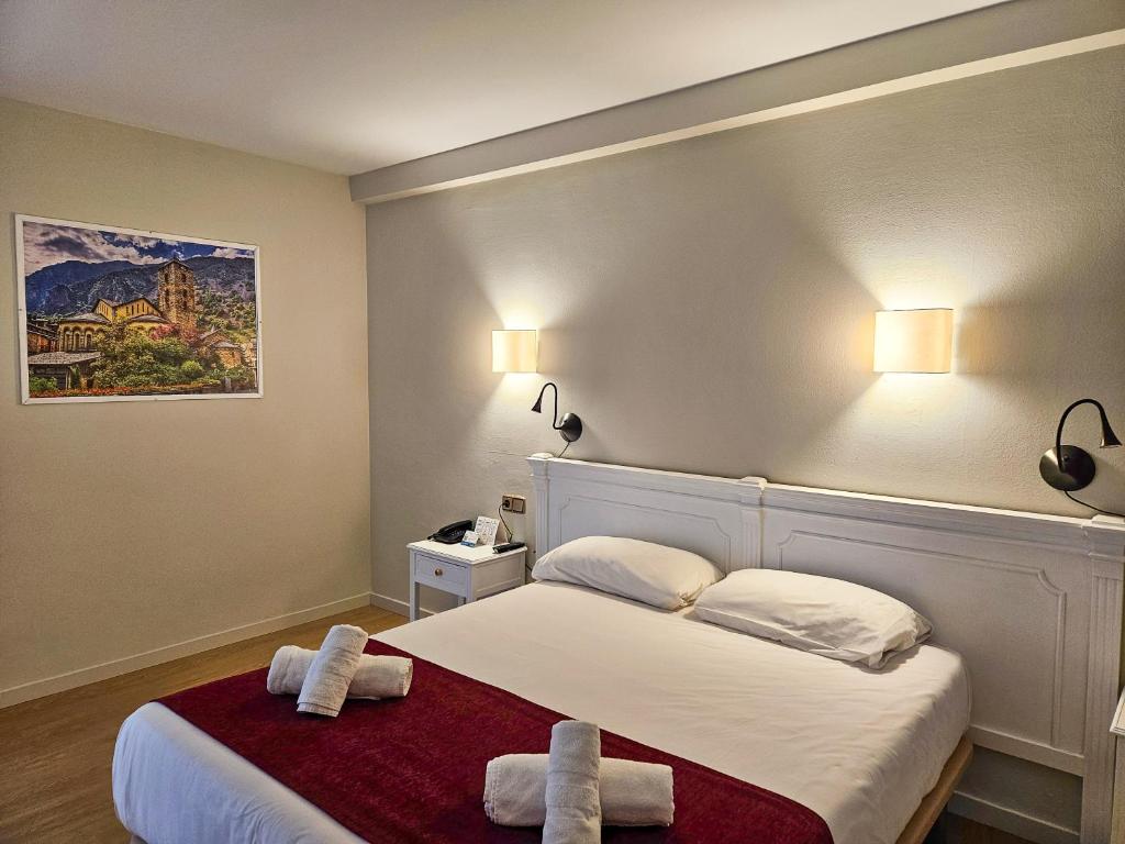 Postel nebo postele na pokoji v ubytování Hotel Pere D'Urg 3000