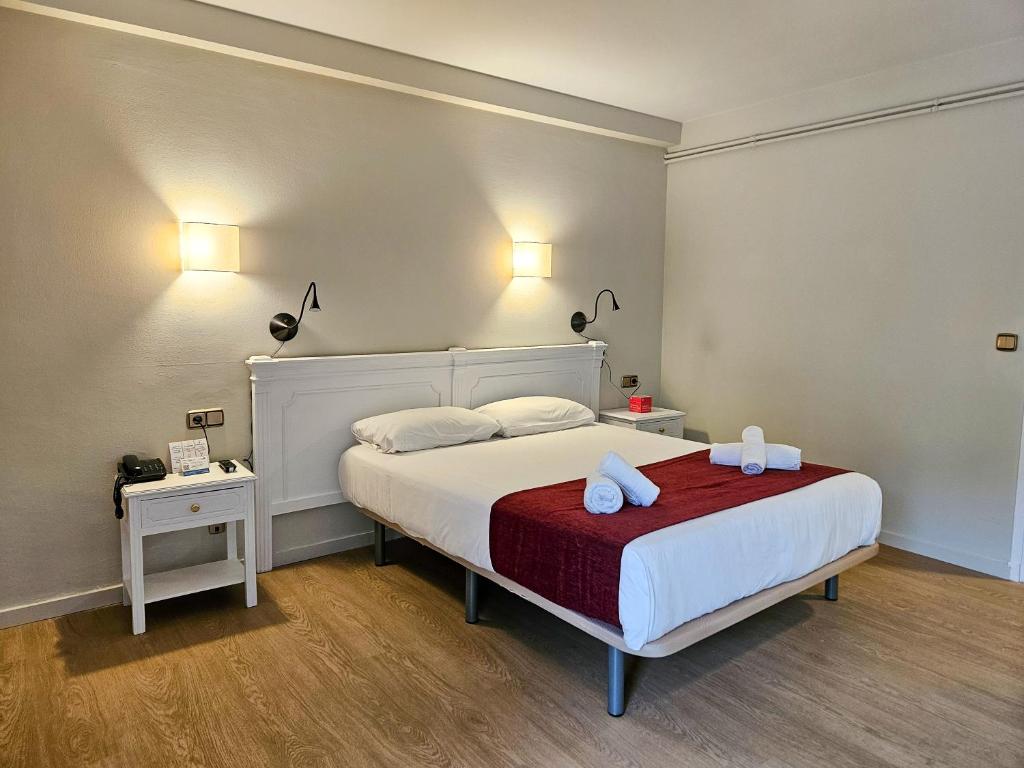 Postel nebo postele na pokoji v ubytování Hotel Pere D'Urg 3000