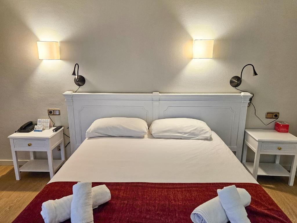 Postel nebo postele na pokoji v ubytování Hotel Pere D'Urg 3000