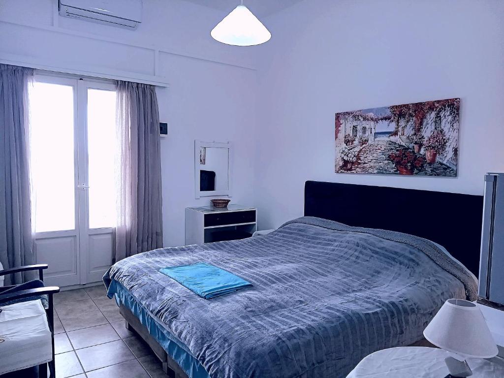Postel nebo postele na pokoji v ubytování Logaras Seaview Apartment