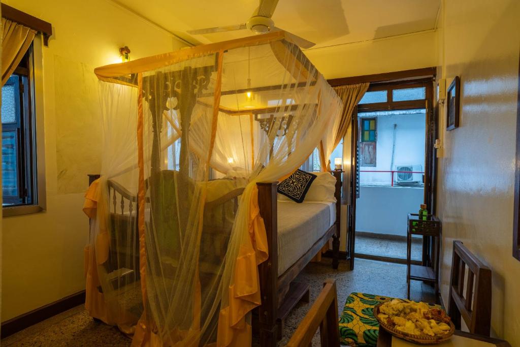 Postel nebo postele na pokoji v ubytování Zenji Hotel