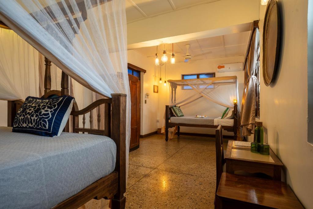 Postel nebo postele na pokoji v ubytování Zenji Hotel