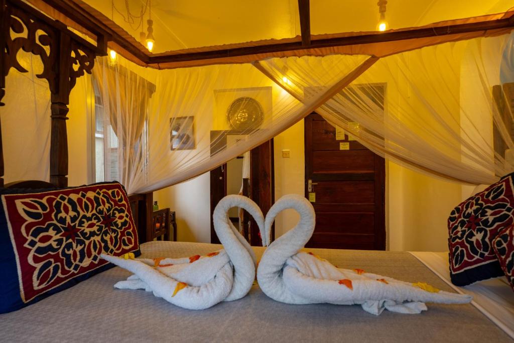 Postel nebo postele na pokoji v ubytování Zenji Hotel