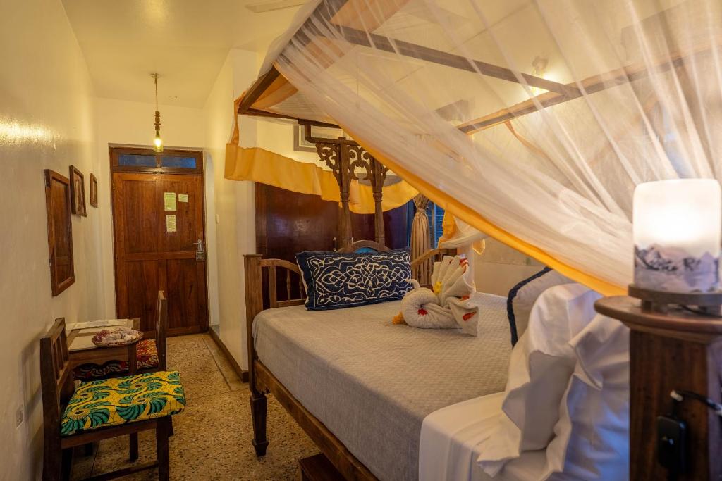 Postel nebo postele na pokoji v ubytování Zenji Hotel
