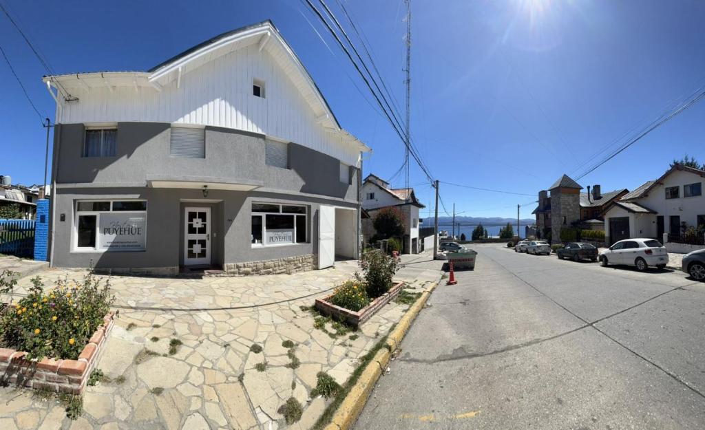 a building on the side of a street at Hosteria Puyehue in San Carlos de Bariloche