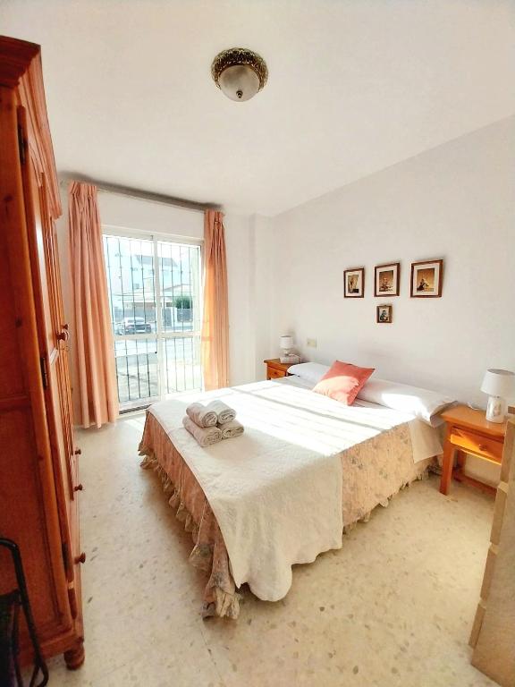 Łóżko lub łóżka w pokoju w obiekcie Top Rota Playa La Costilla Costa de la Luz