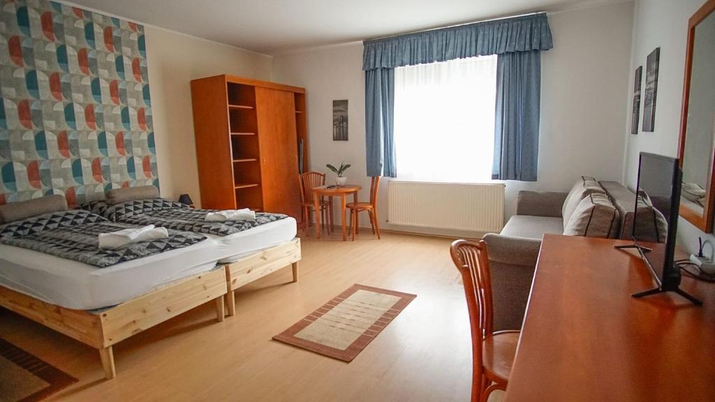 Postel nebo postele na pokoji v ubytování Zam-Zem Holiday Apartman