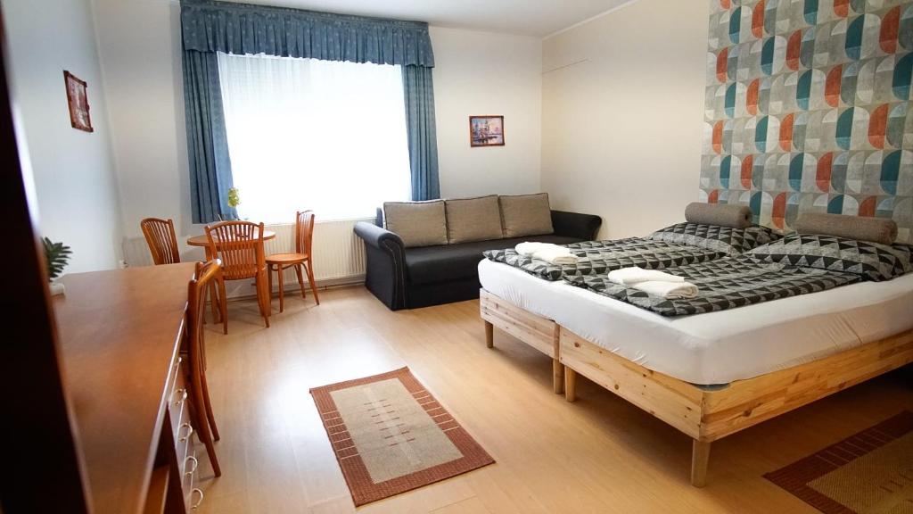 Postel nebo postele na pokoji v ubytování Zam-Zem Holiday Apartman