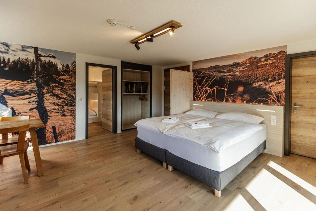 Postel nebo postele na pokoji v ubytování Roggenstock Lodge