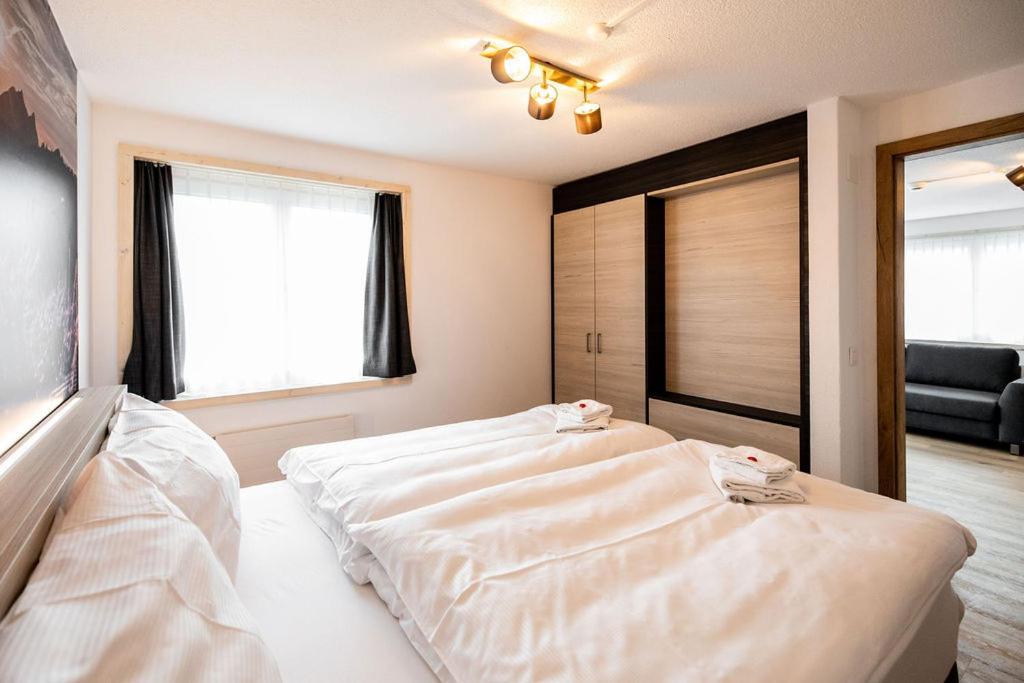 Postel nebo postele na pokoji v ubytování Roggenstock Lodge