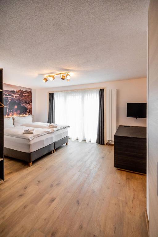 Postel nebo postele na pokoji v ubytování Roggenstock Lodge
