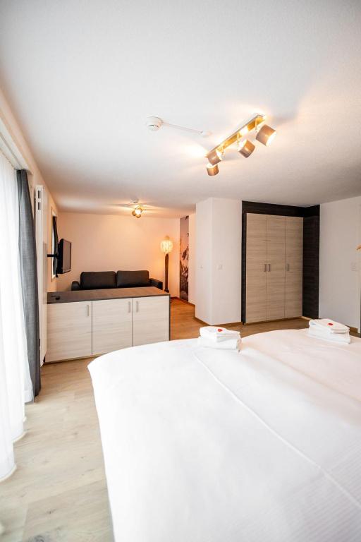 Postel nebo postele na pokoji v ubytování Roggenstock Lodge